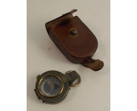 A Negretti &amp; Zambra brass cased compass, with mother of pearl dial, together with a leather case