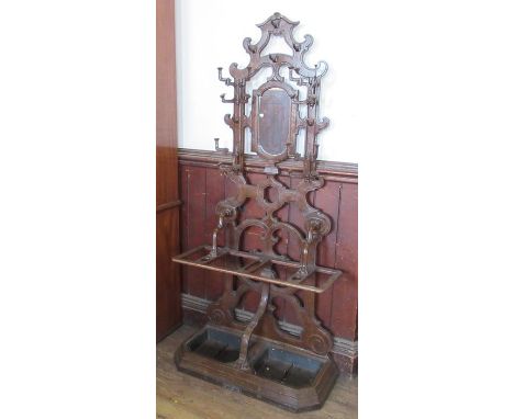 A 19th century&nbsp;Deville Pailliette &amp; Co&nbsp;Arts and Craft style metal and wooden hallstand, with cloak arms and sti