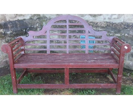 A modern 18th century style garden bench, with ladder trellis back and scroll arms, width 65ins