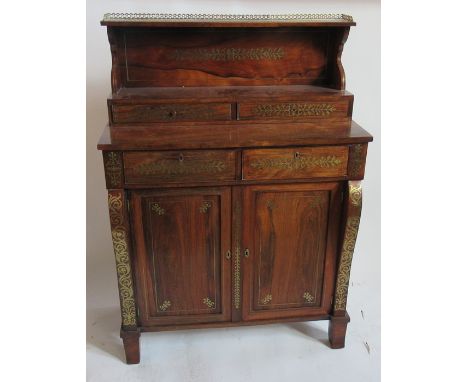 A 19th century rosewood brass inlaid chiffonier, having a galleried shelf over two short drawers, the base fitted with two sh