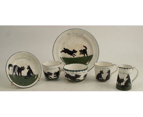 The Bristol Cat &amp; Dog Pottery, a group of tea wares decorated by Louis Wain with black cats and dogs on grass with text, 