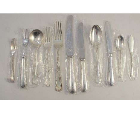 A Garrard &amp; Co part canteen of silver cutlery, in the Old English feather edge pattern, comprising 8 dessert forks, 8 din