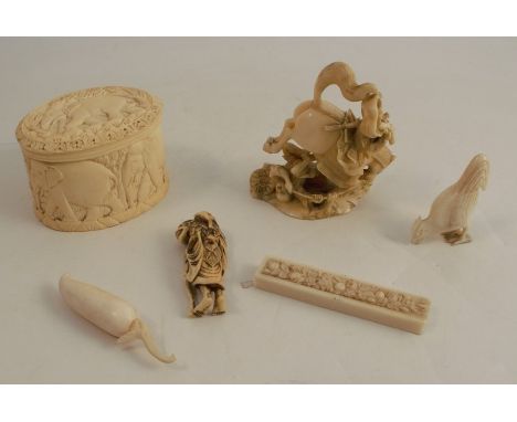 A collection of 19th century carved ivory, to include an Oriental group of a warrior on horseback and another warrior under t