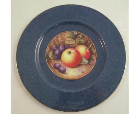 A Royal Worcester plate, decorated with a small central panel of fruit by William Bee, to a Sabrina blue border, dated 1922, 