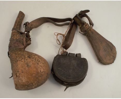 An Antique camel scrotum powder flash, decorated with animals and script, with leather straps, together with a leather pouch 