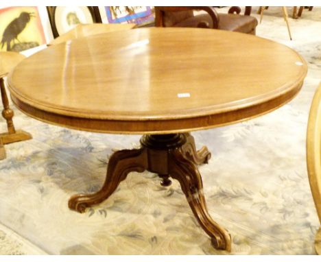 MAHOGANY TILT TOP TABLE. Circular mahogany tilt top table on carved tripod base D: 120 cm 