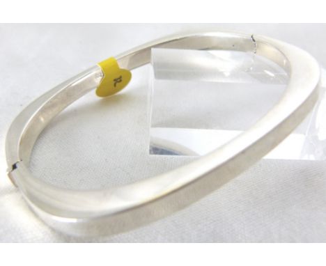 CUSHION HINGED BANGLE. Sterling silver cushion shaped hinged bangle  CONDITION REPORT: Weight 12.05g