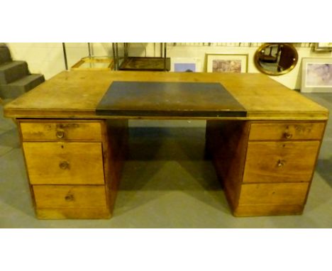 Light oak twin pedestal desk with blue leather insert, pedestal supports consist of three drawers