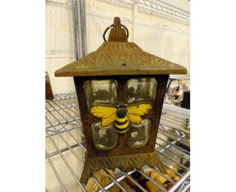 Vintage cast iron exterior lantern with bee decoration