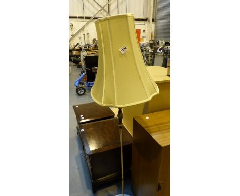 Brass standard lamp with shade on marble base. 