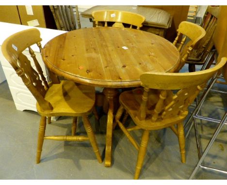 Pine pedestal dining table and four chairs. 