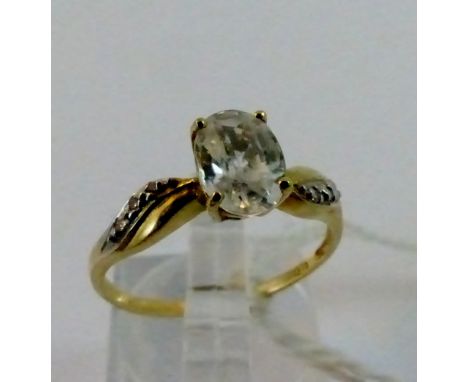 9 ct yellow gold solitaire set with diamond shoulder ring. Size M.