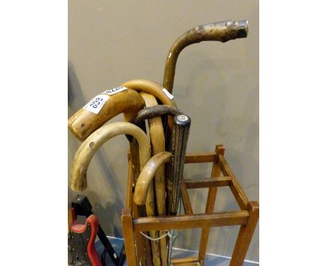 Bundle of nine mixed vintage walking sticks and a golf club