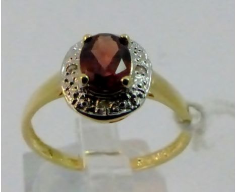 9 ct gold diamond and garnet ring. Size O