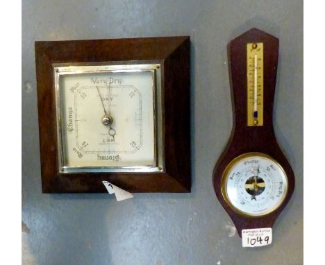Vintage aneroid barometer and a modern banjo barometer. 