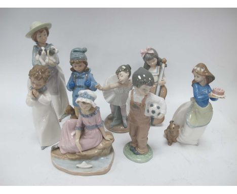 A large collection of Nao figurines to include 'What an armful', girl with puppy and cake, 'My first bow' and girl with cello