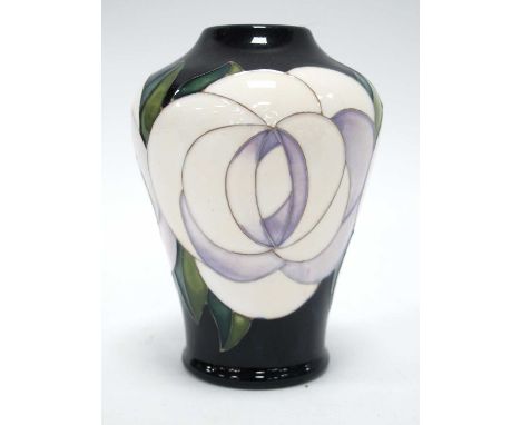 A Moorcroft Pottery Vase, decorated in the 'White Rose' design by Emma Bossons, shape 576/4, impressed and painted marks, 11c
