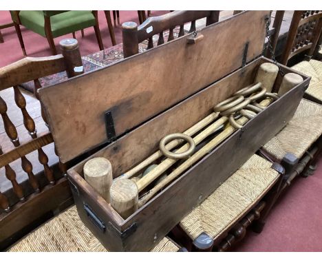 Croquet - Four mallets, six metal hoops, nine balls and eight gilt wood rings, in a carry box