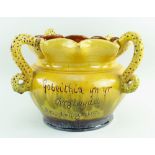 A EWENNY CLAYPITS POTTERY SLIPWARE JARDINIERE BY EVAN JONES of bellied form, with crimped rim and