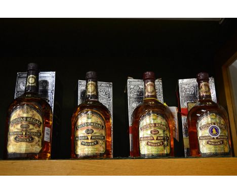 Chivas Regal Scotch whisky, one litre bottle together with three standard bottles, all boxed.