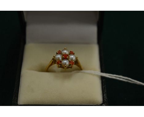 A 9ct gold, coral and pearl ring, size O.