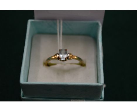 A 9ct gold ring set with a bright blue stone, size P.