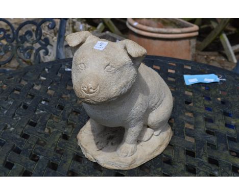 A reconstituted stone model of a dog.