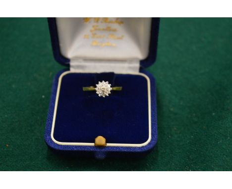 An 18ct gold and diamond cluster ring, size N½.