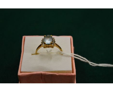 A 9ct gold, cubic zirconia and blue stone ring, size N.