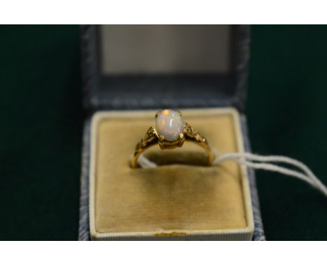 A 9ct gold and opal ring, size L.