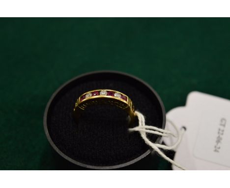 A 9ct gold, ruby and cubic zirconia ring, pierced to the side 'I love you', size O.