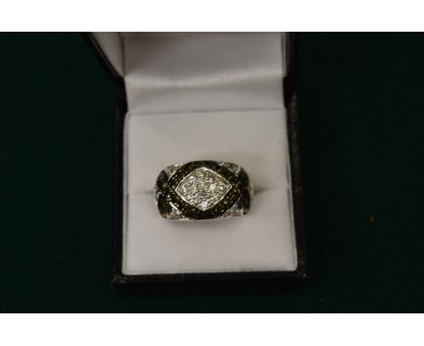 A silver, diamante and black stone ring, boxed.