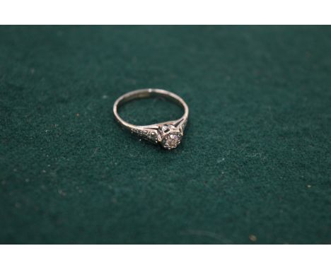 An 18ct gold and diamond single stone ring, size L½.