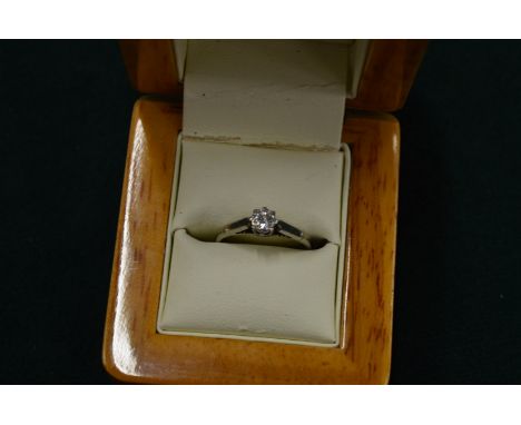 An 18ct gold and platinum single stone diamond ring, size K.