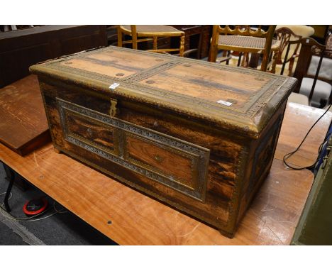 An Eastern brass bound hardwood trunk.
