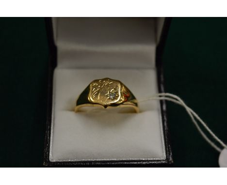 A 9ct gold signet ring set with a small diamond, size Z.