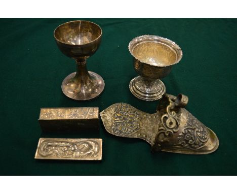 An Eastern white metal goblet with engraved decoration, a Chinese white metal bamboo decorated box and cover, a model of a sh