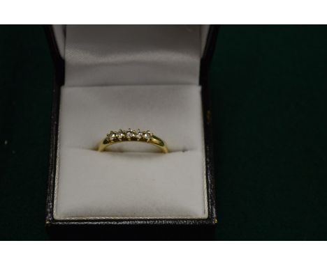 A 9ct gold and diamond five stone ring, size L.