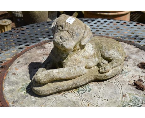 A reconstituted stone model of a dog.