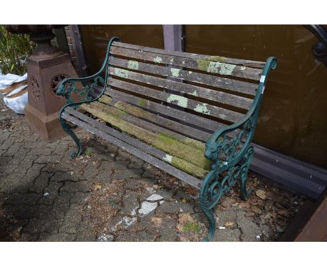 A cast metal and wooden slatted garden bench.