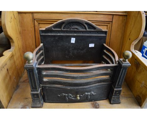 A small cast iron fire grate.