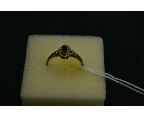 A 9ct gold, sapphire and diamond ring, size O.