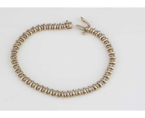 A 9ct gold diamond set line bracelet, the brilliant cuts in alternating baton settings, 19.5cm long, tongue and box clasp, 2c