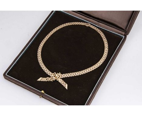 A 9ct gold Hamilton Laidlaw boxed diamond bow necklace, the flattened textured links united by an abstract diamond set bow dr