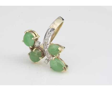 A 14ct gold jade and diamond dress ring, of floral design, the four cabochons in claw settings set with eight cut diamonds on