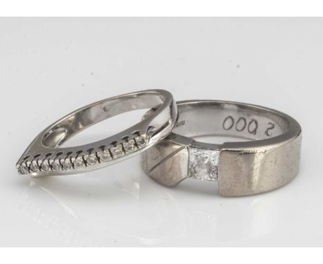 Two white gold continental dress rings, one set with a single CZ ring size M1/2 and a line set paste example ring size K 11g 