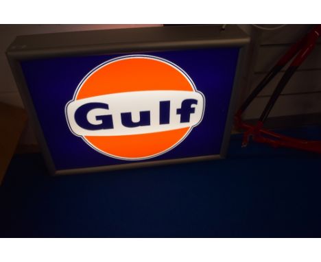A double sided Gulf advertising light box.