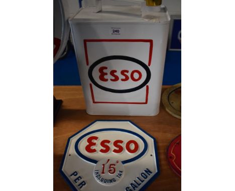 A reproduction Esso can and plaque.