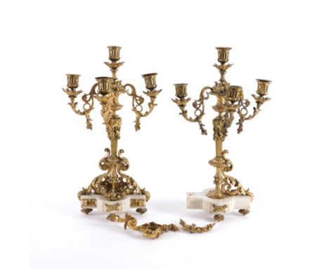 A PAIR OF FRENCH LOUIS XVI STYLE GILT-BRONZE MOUNTED WHITE MARBLE FOUR LIGHT CANDELABRA (2)Early 20th Century 
The candle noz
