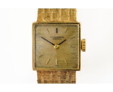 AN 18CT IWC LADY'S WATCHWith a small square dial, with gilded hour markers, signed International Watch Co, on a bracelet stra